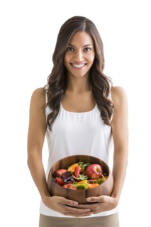 Studio portrait of smiling woman holding bowl of fruit