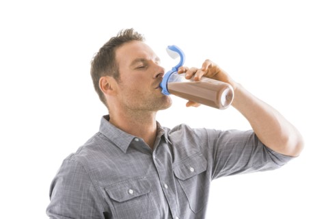 Studio shot of man drinking protein shake