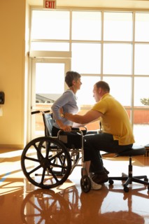 Physical therapist working with patient