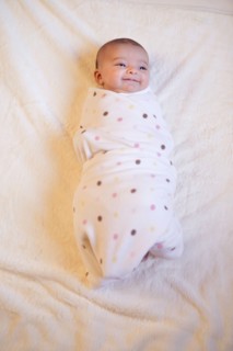 Baby (0-1month) wrapped in blanket