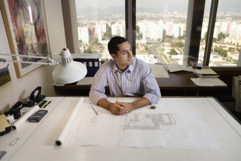 Architect sitting at draft table