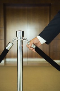 Man holding velvet rope