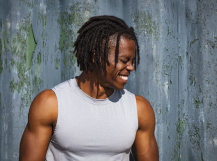 Portrait of smiling athlete man outdoors