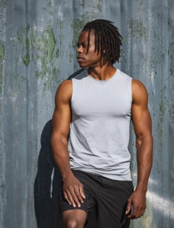 Portrait of athlete man against wall