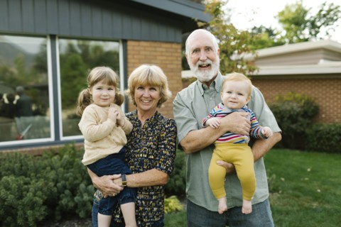 Portrait of smiling grandparents with grandchildren