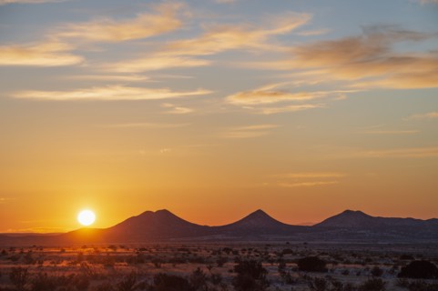 Sun setting over hills in Cerrillos Hills State Park