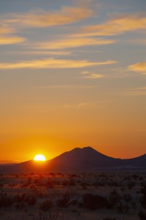 Sun setting over hills in Cerrillos Hills State Park