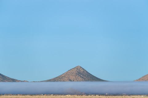 Fog above desert landscape in Cerrillos Hills State Park