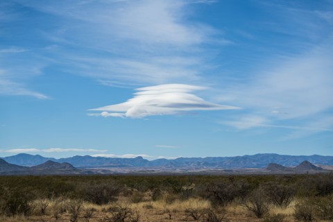 Lenticular cloud over landscape
