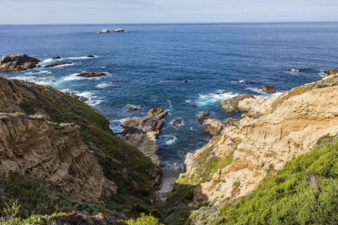 Ocean waves crashing against Big Sur coast
