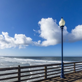 Pier in sea on sunny day