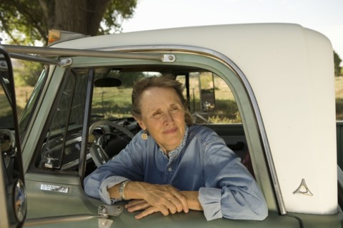 Senior woman in pick-up truck