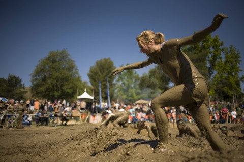 Sportswoman running in mud