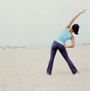 Woman exercising on beach