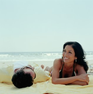 Couple lying on beach