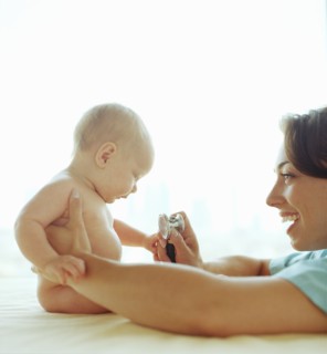 Doctor examining baby girl