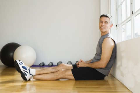 Portrait of man sitting in gym