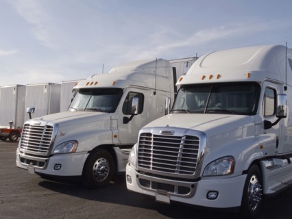 Semi trucks in parking lot