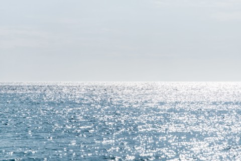 Calm sea surface reflecting sunlight