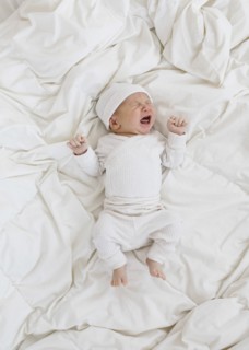 Overhead view of newborn boy