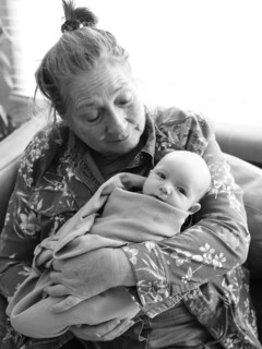 Grandmother holding newborn grandson