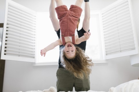 Father swinging daughter