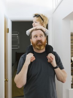 Father carrying son