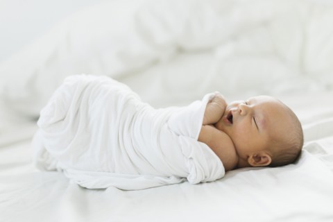 Swaddled newborn boy