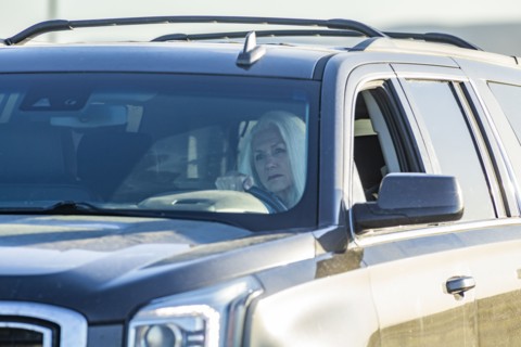 Senior woman driving SUV