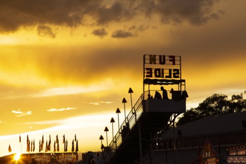 Amusement park rides at sunset