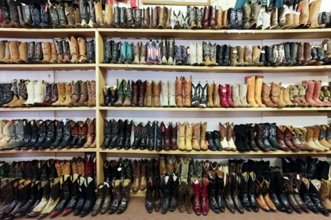 Vintage cowboy boots on shelves