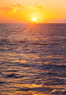 Ocean surface reflecting sunlight at sunrise