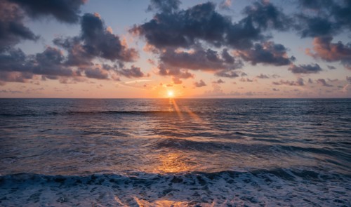 Dramatic sunrise sky above ocean