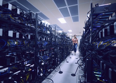 Female technician walking in server room