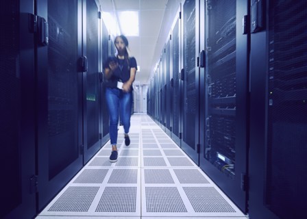 Female technician walking in server room