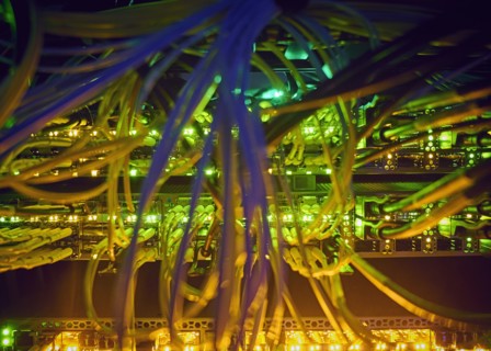 Illuminated network cables in server room