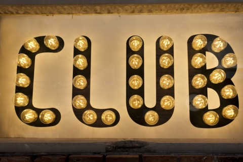 Close-up of illuminated club sign