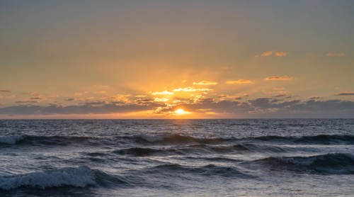 Ocean waves at sunset