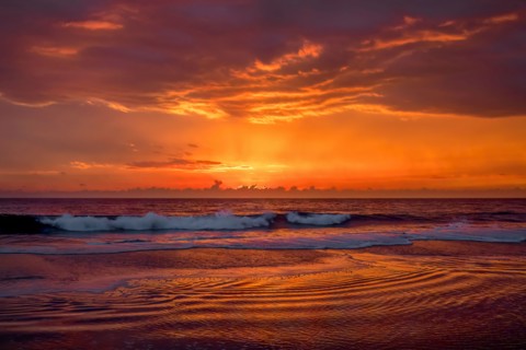 Dramatic sunset sky above ocean