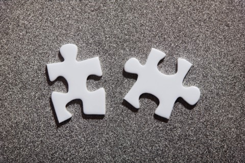 Two white jigsaw pieces