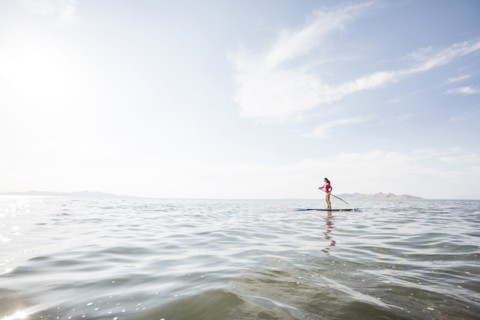 Woman paddleboarding on lake