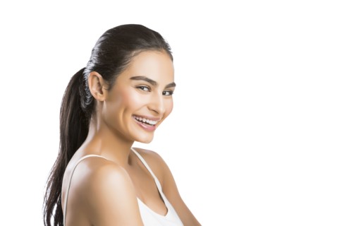 Portrait of smiling young woman looking at camera