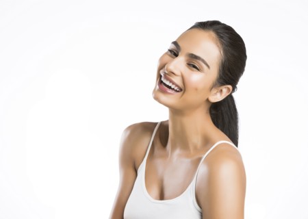 Portrait of smiling young woman looking at camera