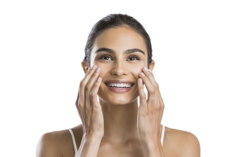Portrait of young woman doing face massage