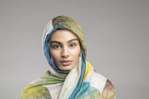 Studio portrait of beautiful woman wearing headscarf