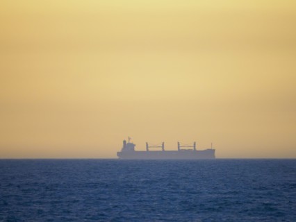 Container ship cruising on calm sea