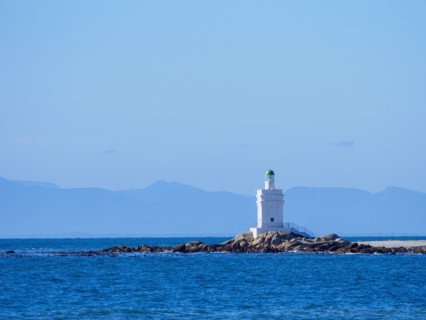 White lighthouse on sea coast