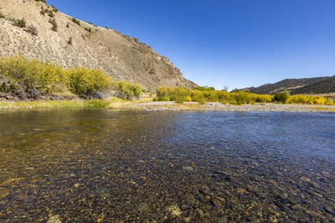Smooth clear creek in valley