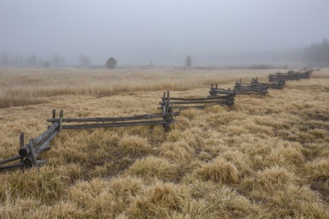 Rail fence in rural scenery at fall