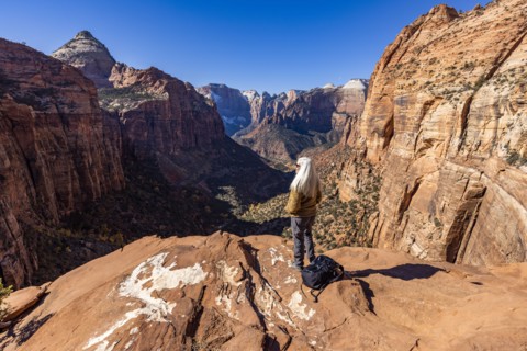 Senior female hiker at overlook of Zion National Park